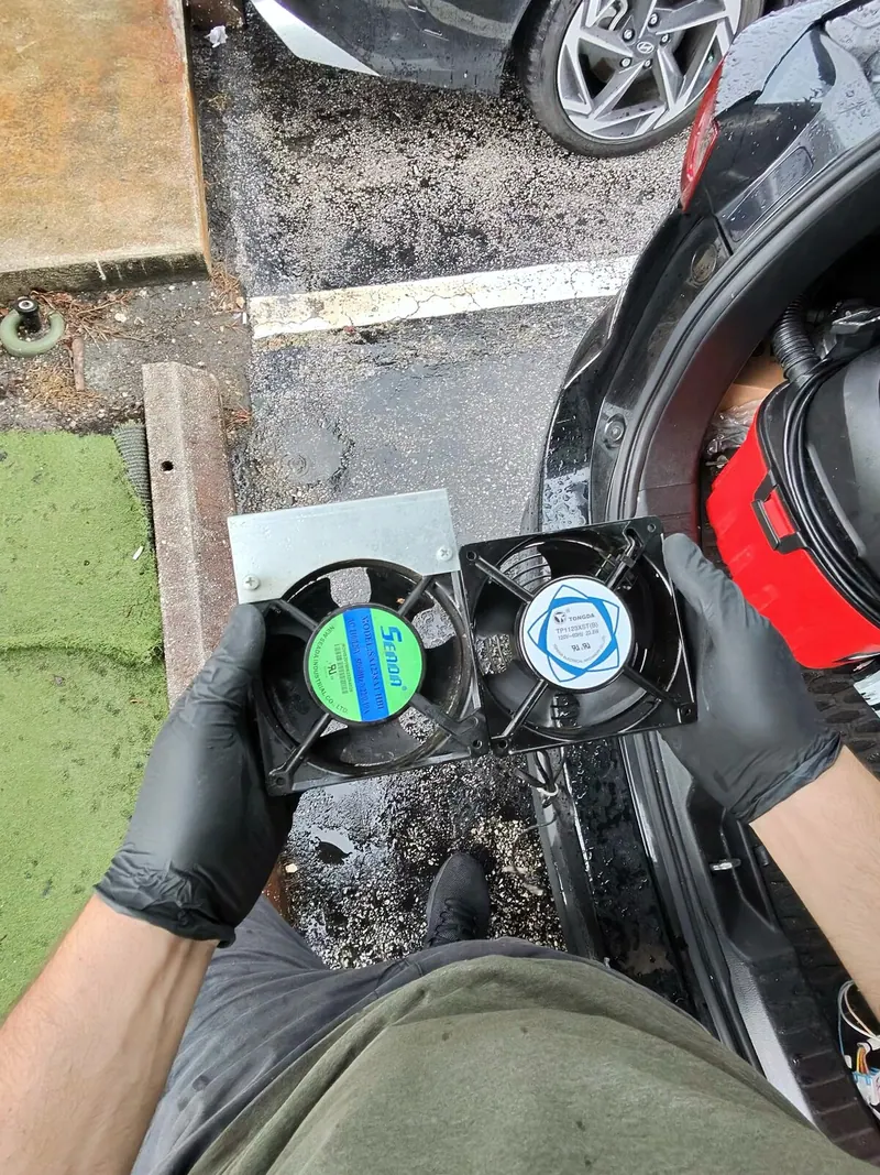 Old and new condenser fan motors