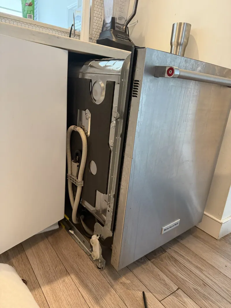 Dishwasher pulled out from under the counter