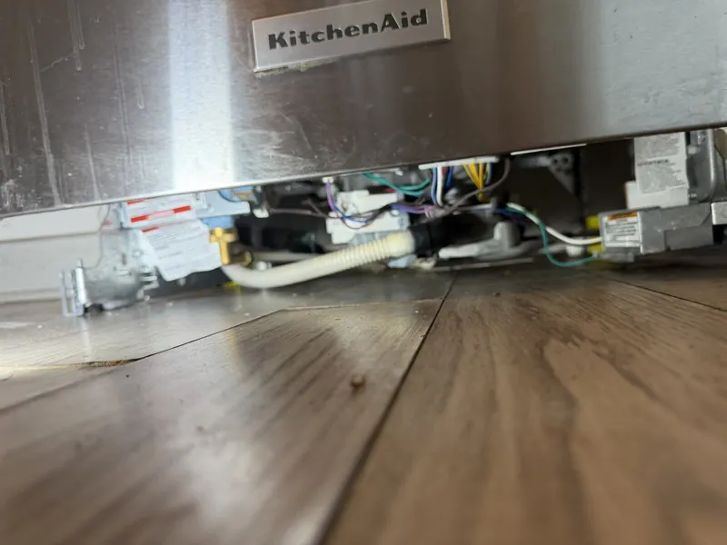 Wiring and plumbing under the dishwasher