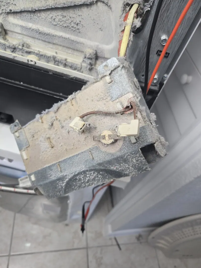 Dusty heating element housing and thermal fuse