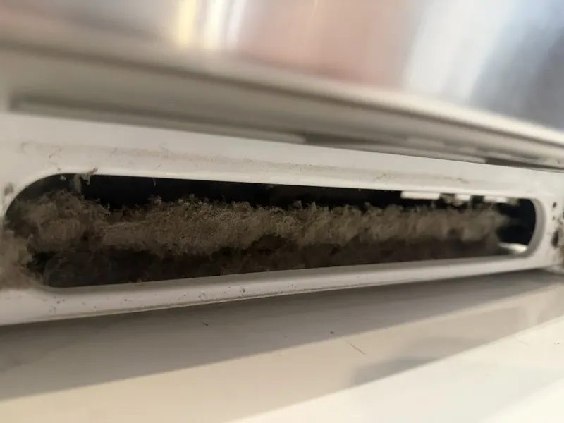 Thick dust buildup in a vent grille