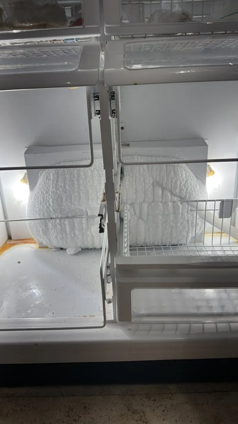 Ice buildup on the back wall of the refrigerator