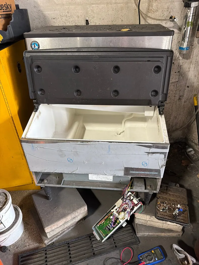 Ice machine with the bin open and the control board out
