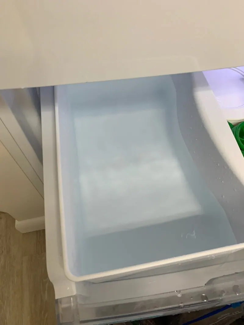 Kenmore refrigerator drawer full of standing water from the ice maker leak