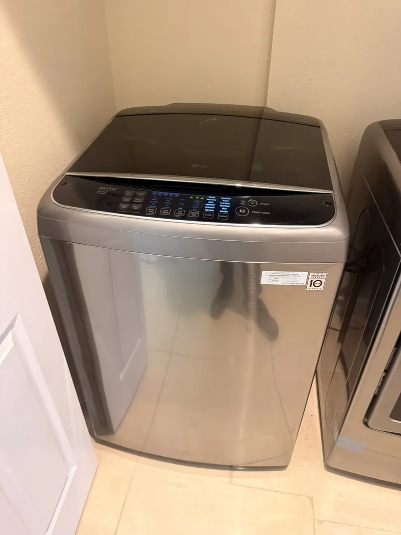 LG top-load washer in the laundry room