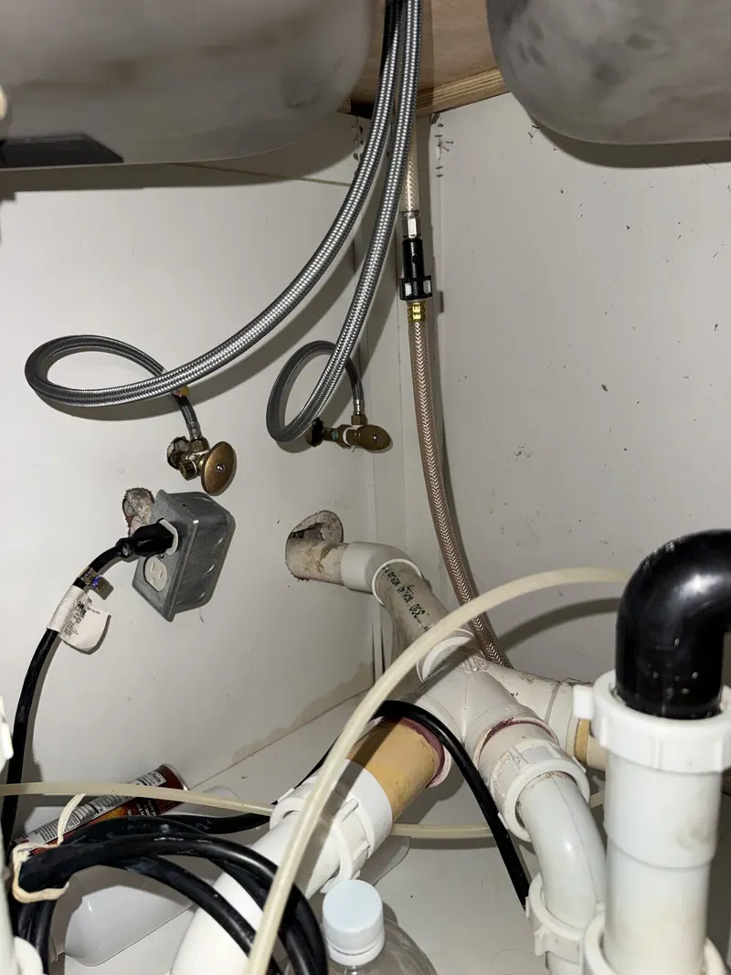 Water and drain connections under the sink