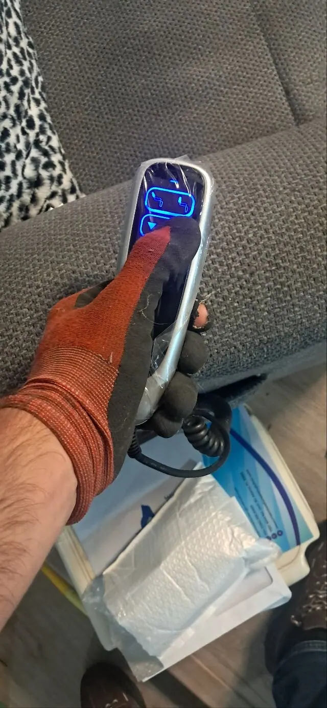 Lift chair hand control with the buttons lit up