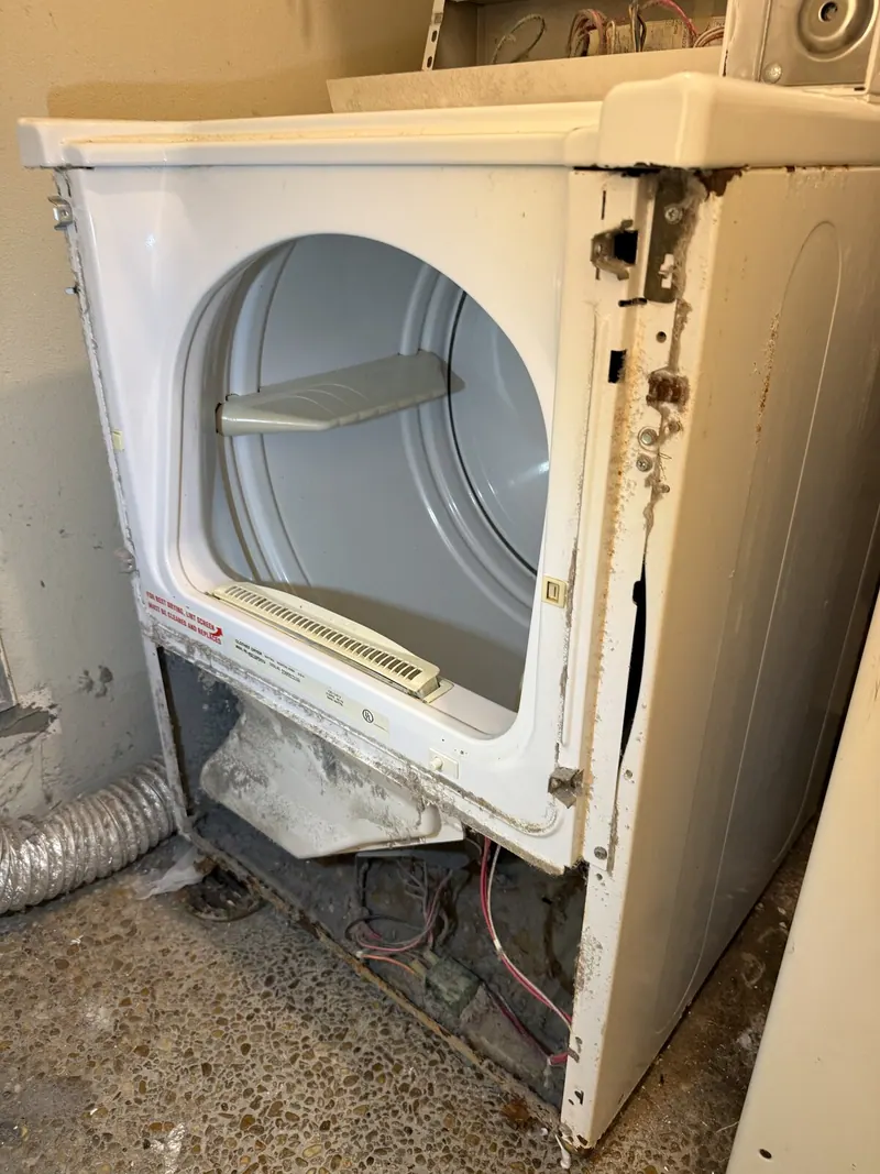 Maytag commercial dryer with the front panel removed