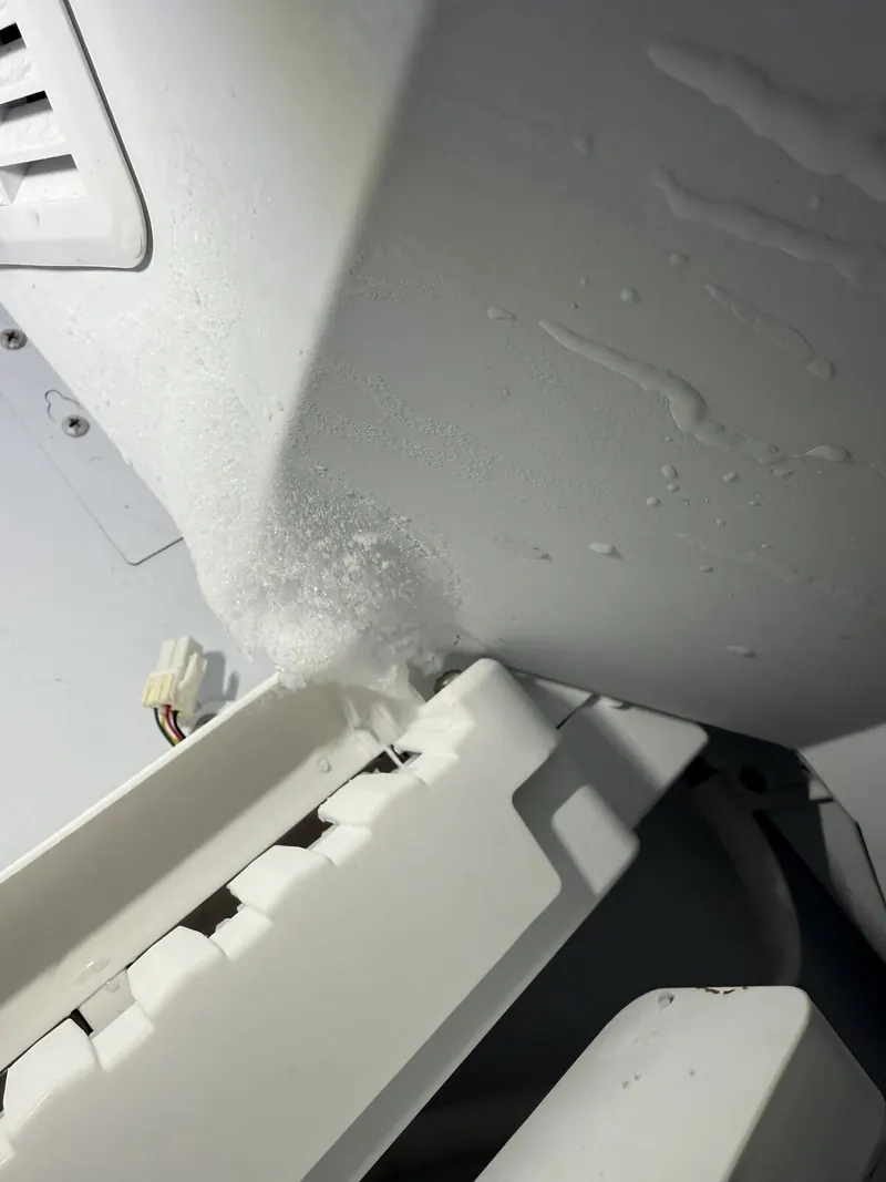 Ice in the freezer compartment near the ice maker