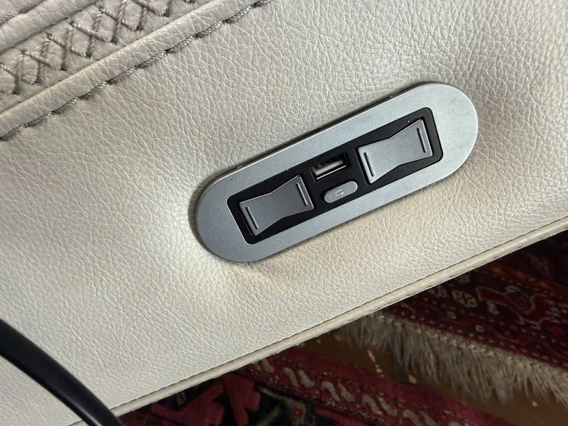 Switch panel with a USB port on the arm of the reclining sofa