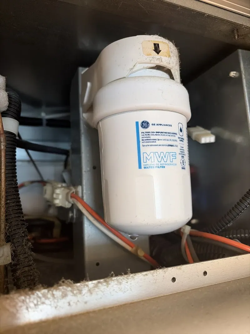 Water filter in its housing
