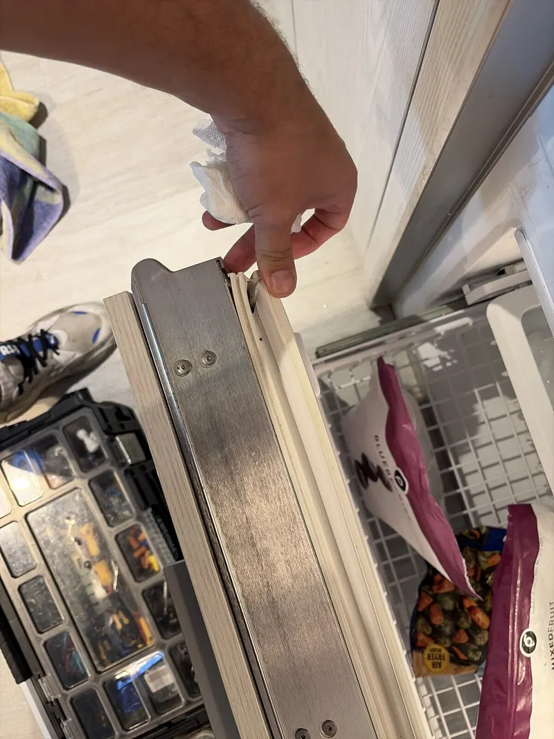 Freezer drawer seal being checked