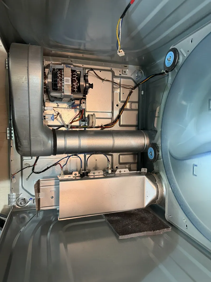 Dryer opened up: motor, blower housing and heating element
