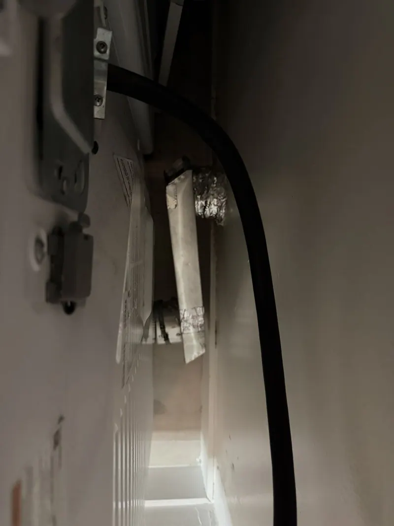 Back of the dryer with the vent hose connection