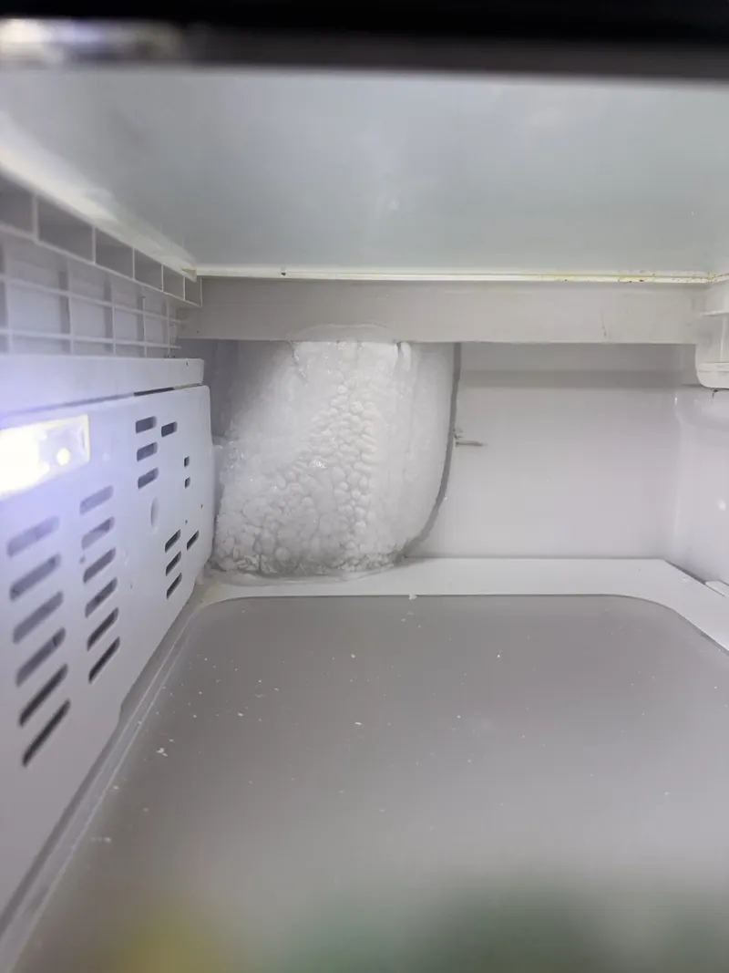 Heavy ice buildup inside the freezer compartment