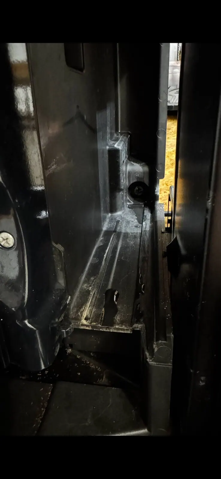 Metal parts and screws inside the unit