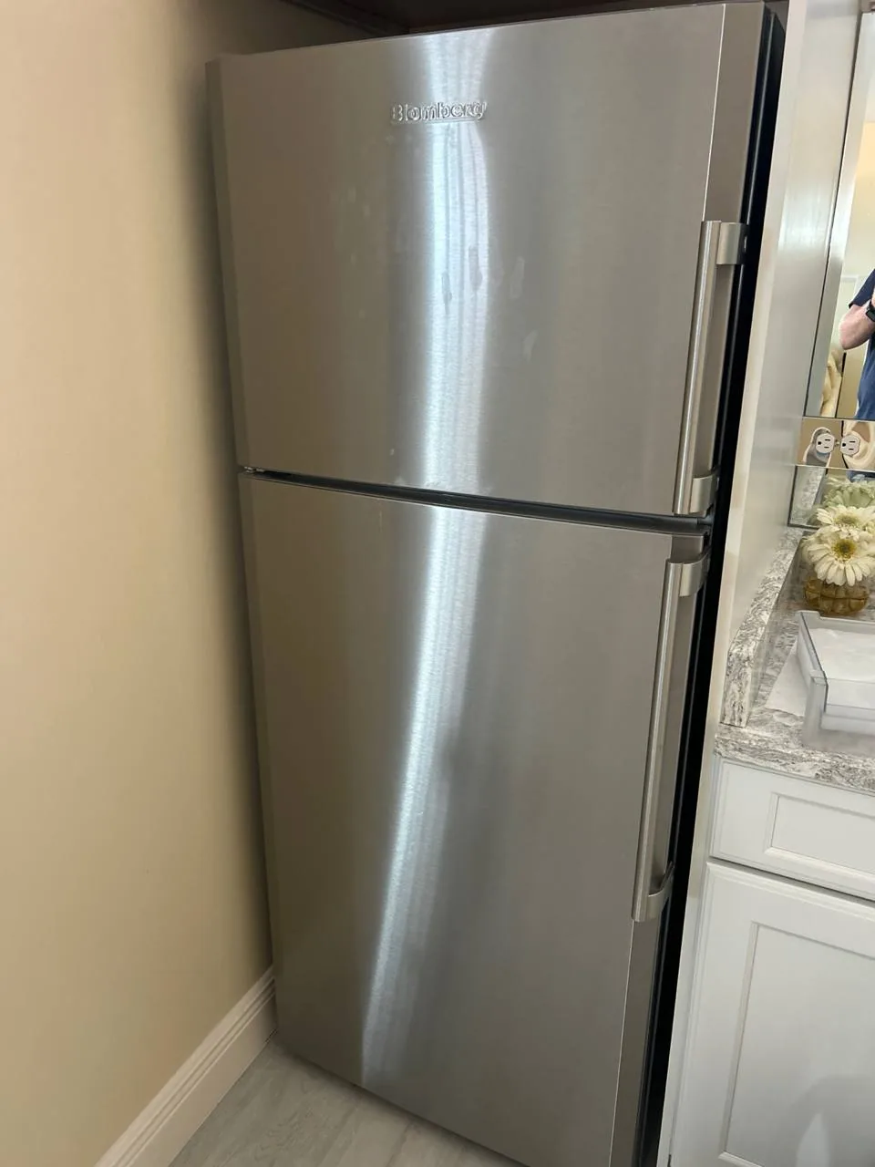 A stainless steel Blomberg refrigerator in a kitchen