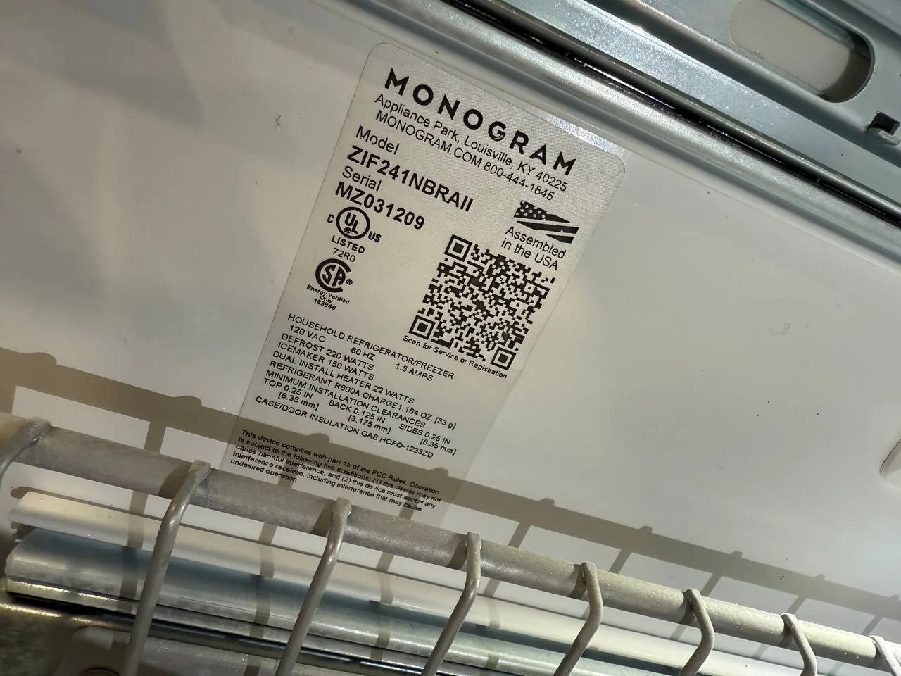 GE Monogram refrigerator service: a Monogram refrigerator model and serial number label