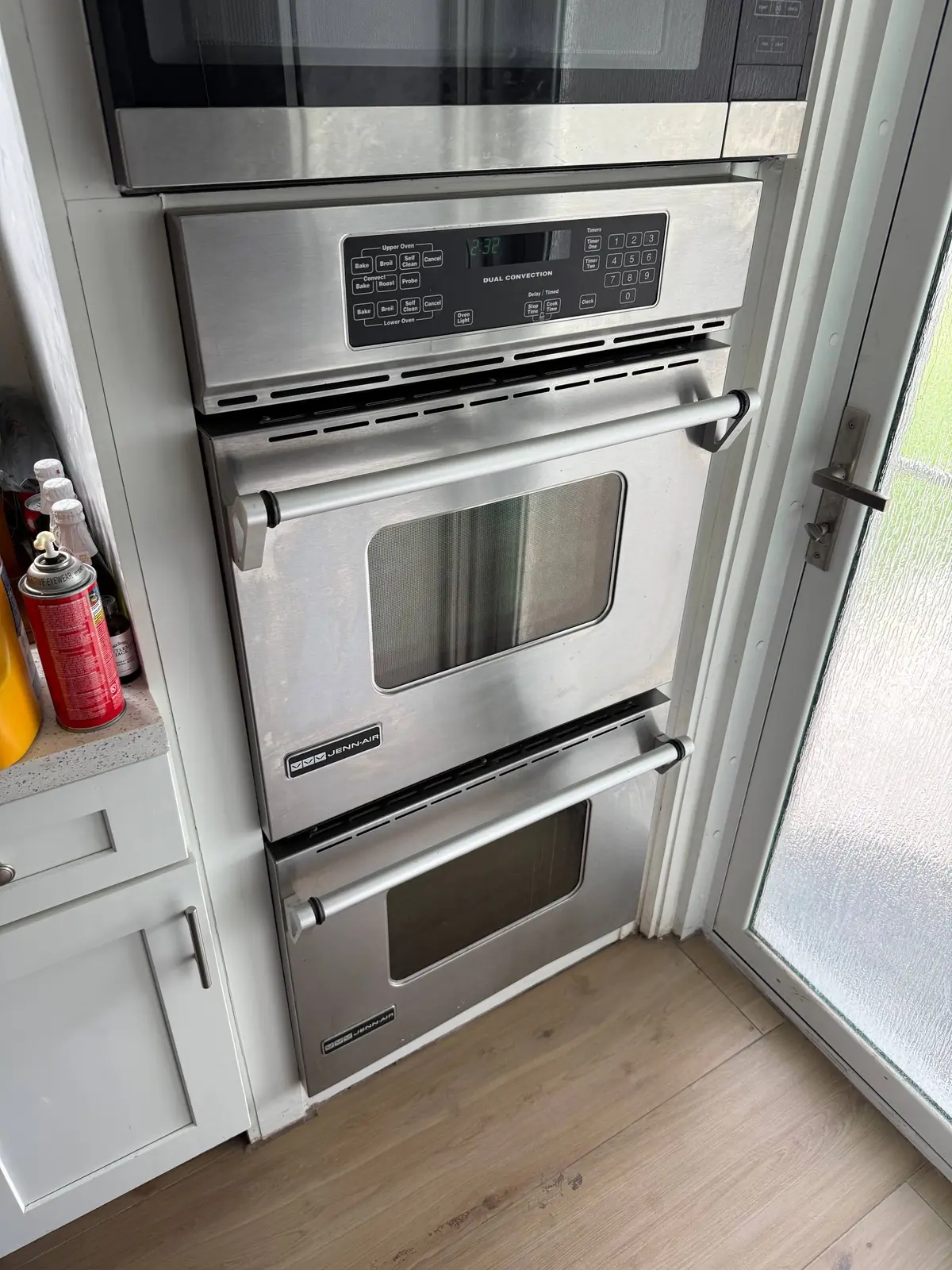 JennAir oven service: a Jenn-Air double wall oven with a microwave above it in a kitchen setting