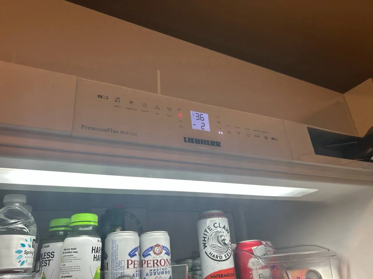 A Liebherr refrigerator's control panel and items inside