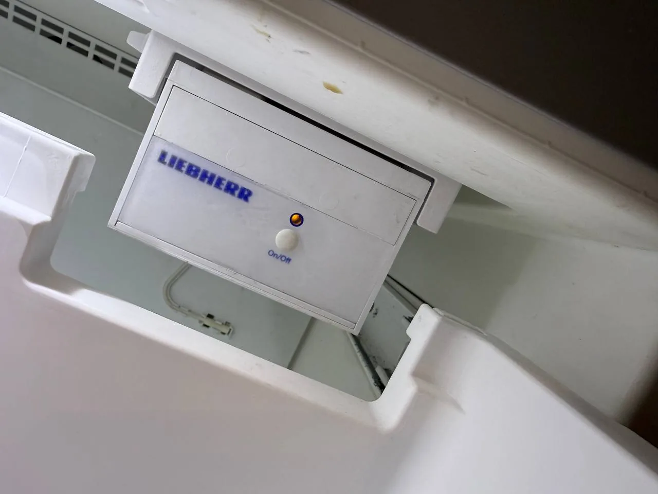 A Liebherr branded component inside a refrigerator