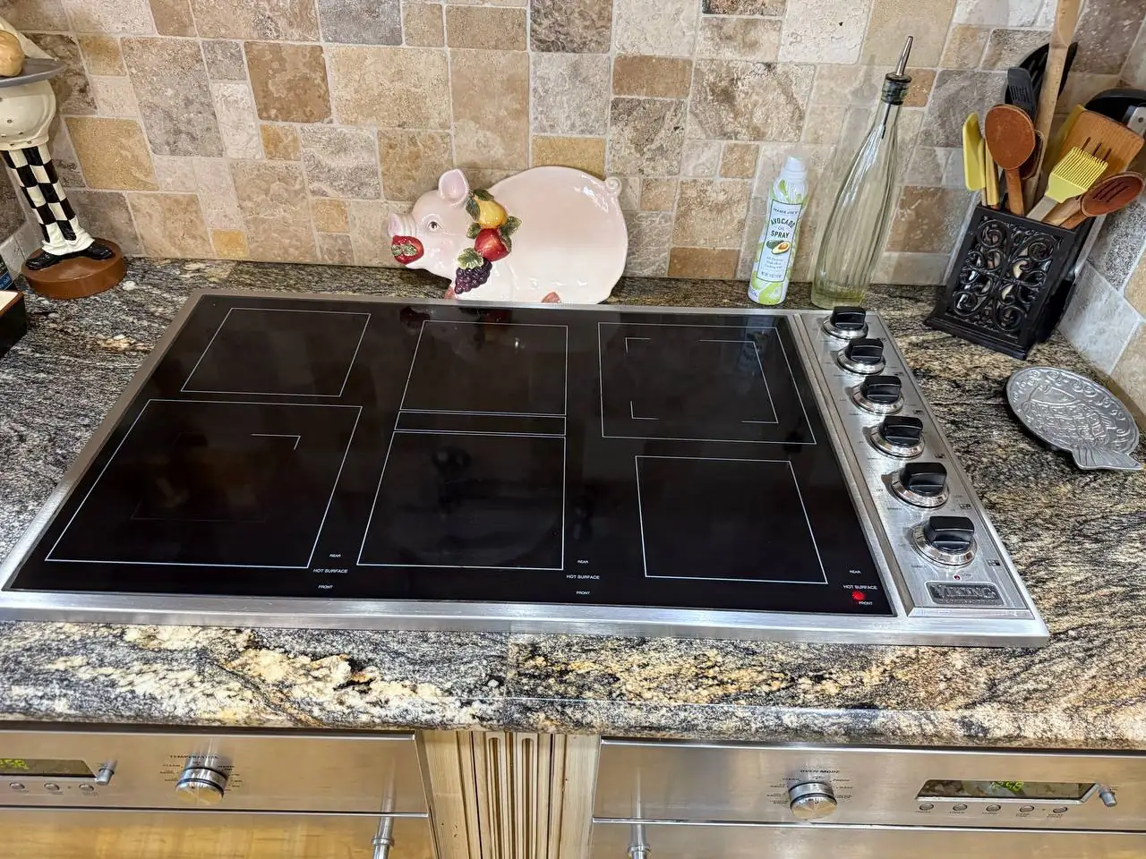 A Viking cooktop in a kitchen setting with decorative items on the counter